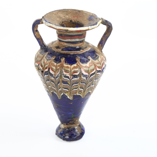 1060 - An ancient Greek Glass Amphoriskos, perfume bottle, probably 2nd-3rd century BC, height 11cm