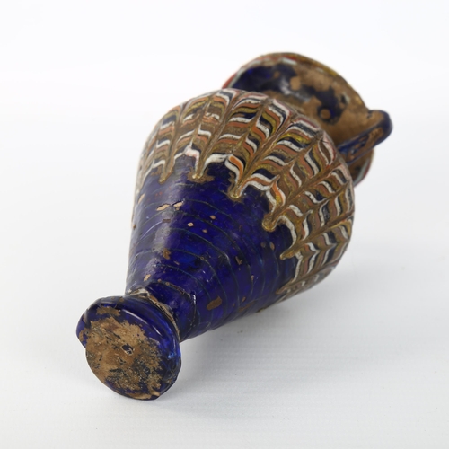 1060 - An ancient Greek Glass Amphoriskos, perfume bottle, probably 2nd-3rd century BC, height 11cm