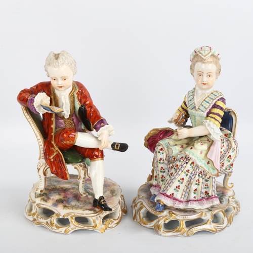 1061 - A pair of 19th century porcelain figures of seated children sewing and reading, no factory marks, he... 