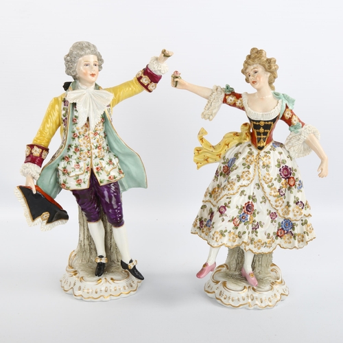 1062 - A pair of 19th century German porcelain dancing figures, blue underglaze marks, height 23cm