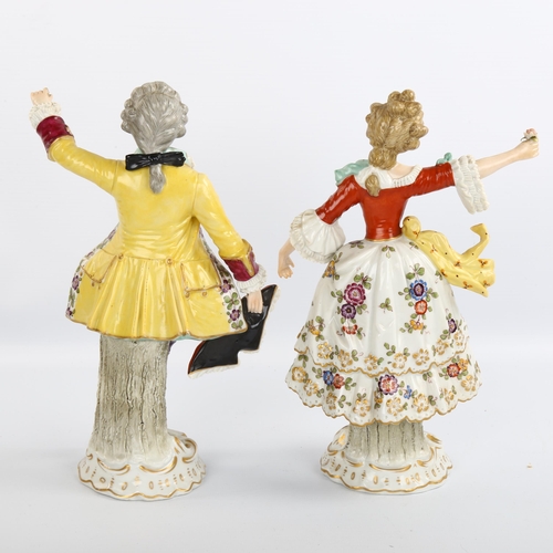 1062 - A pair of 19th century German porcelain dancing figures, blue underglaze marks, height 23cm