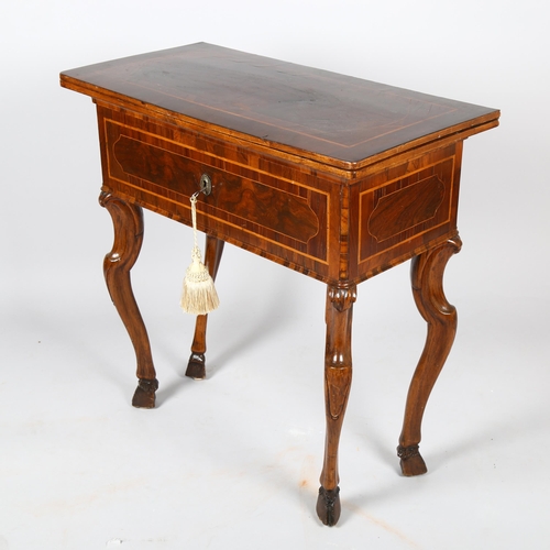 1065 - An 18th century Italian/Maltese walnut fold over combination tea/writing table, the top opening to r... 