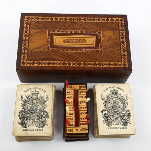 1070 - A Tunbridge Ware besique rosewood and parquetry inlaid games box, the interior fitted with cards and... 