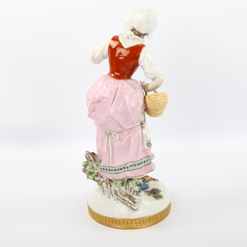 1073 - Dresden porcelain figure of a woman with flower basket, height 25cm