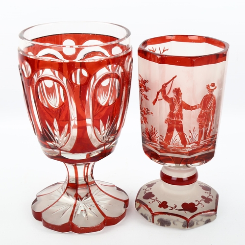 1081 - 2 Bohemian ruby overlay glass goblets, 1 with etched hunting scenes, largest height 18cm (2)