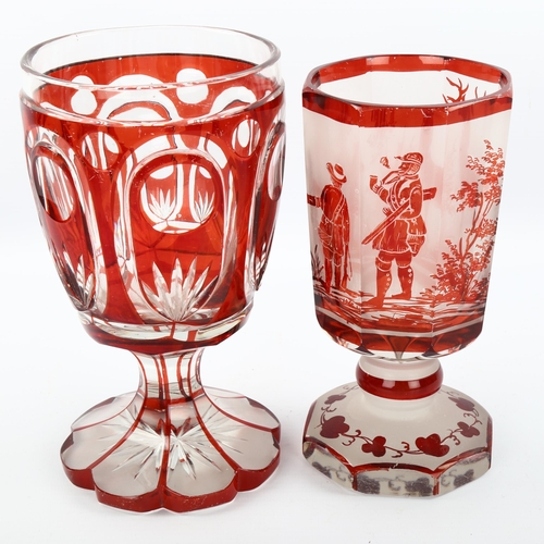 1081 - 2 Bohemian ruby overlay glass goblets, 1 with etched hunting scenes, largest height 18cm (2)