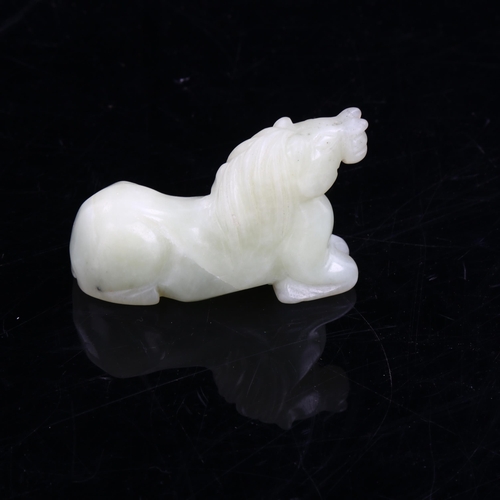 1089 - A Chinese pale green jade horse, length 8cm