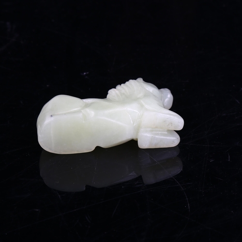 1089 - A Chinese pale green jade horse, length 8cm