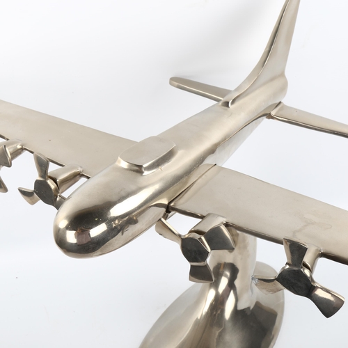 1110 - A cast-aluminium desk ornament of a 4-propeller aircraft, wingspan 81cm, length 48cm