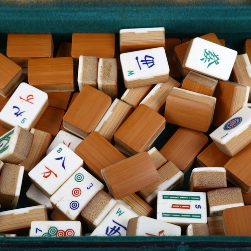 1115 - A Chinese bone and bamboo Mahjong set, with racks and instructions in Victorian inlaid box