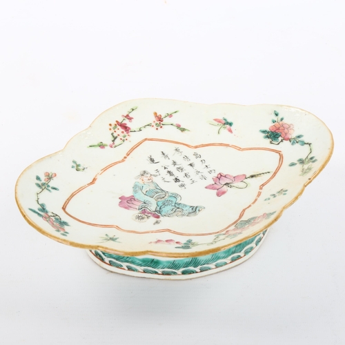 1116 - A Chinese oval porcelain dish on foot, with painted enamel decoration and text, length 23cm