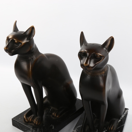 1118 - A pair of patinated bronze Egyptian style cats on marble bases, height 29cm, unsigned, modern