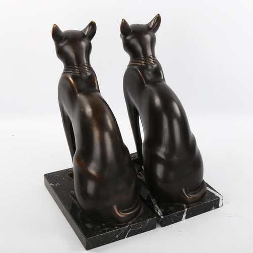 1118 - A pair of patinated bronze Egyptian style cats on marble bases, height 29cm, unsigned, modern