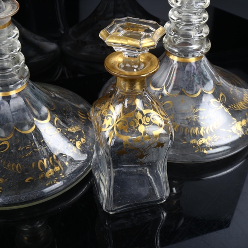 1120 - A pair of 18th/19th century gilded glass ship's decanters, with neck rings and original stoppers, di... 