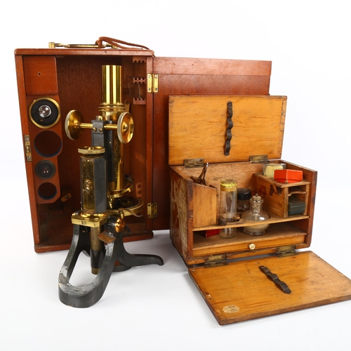 1123 - Swift & Son brass-mounted student's microscope, with spare lenses, in original mahogany case with br... 