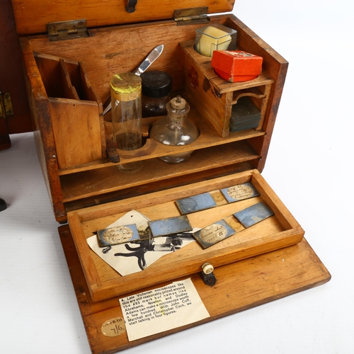 1123 - Swift & Son brass-mounted student's microscope, with spare lenses, in original mahogany case with br... 