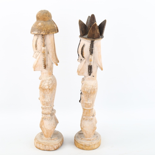 1125 - A pair of African carved and painted wood Tribal figures, height 32cm