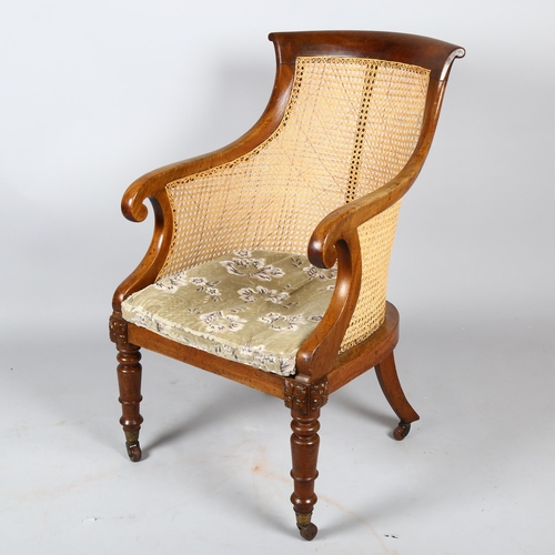 1136 - A 19th century mahogany framed Gillows style Bergere tub chair, with cane panel back, squab seat and... 