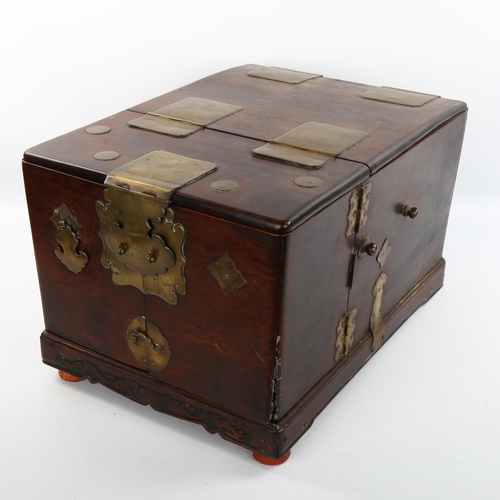 1153 - An Oriental brass-bound hardwood dressing case, length 38cm, width 27cm, height 23cm