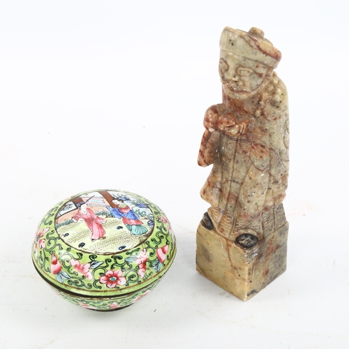 1158 - A Chinese soapstone standing figure, height 13cm, and a small enamelled metal pot, diameter 6cm (2)