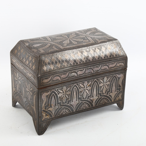 1175 - A Moroccan metal casket with inlaid white metal decoration, length 17cm