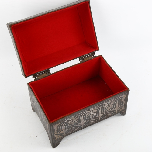 1175 - A Moroccan metal casket with inlaid white metal decoration, length 17cm