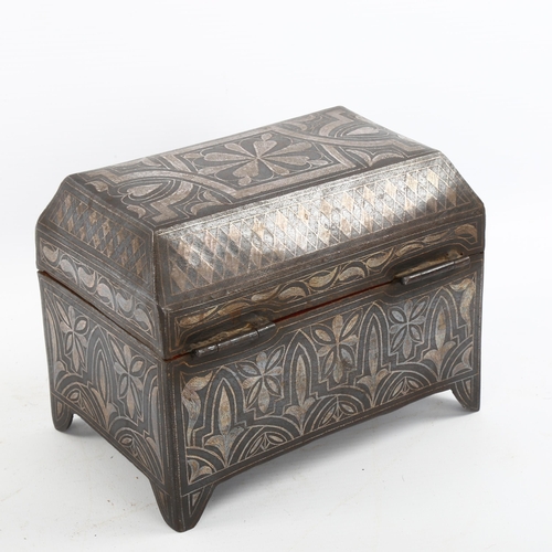 1175 - A Moroccan metal casket with inlaid white metal decoration, length 17cm