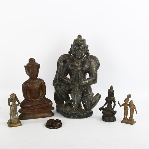 1182 - A group of Indian and Chinese bronze deities, a carved soapstone figure, height 24cm, and a small br... 