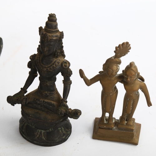 1182 - A group of Indian and Chinese bronze deities, a carved soapstone figure, height 24cm, and a small br... 