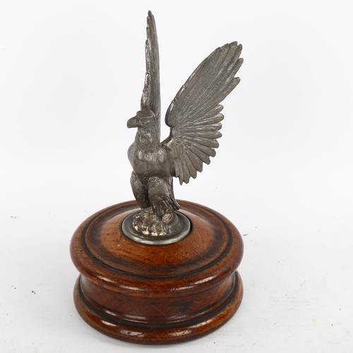 1184 - A mid-20th century spelter eagle design car mascot on wooden plinth, height 16cm