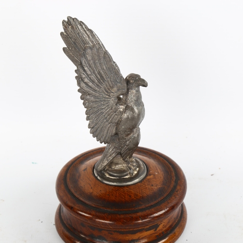 1184 - A mid-20th century spelter eagle design car mascot on wooden plinth, height 16cm