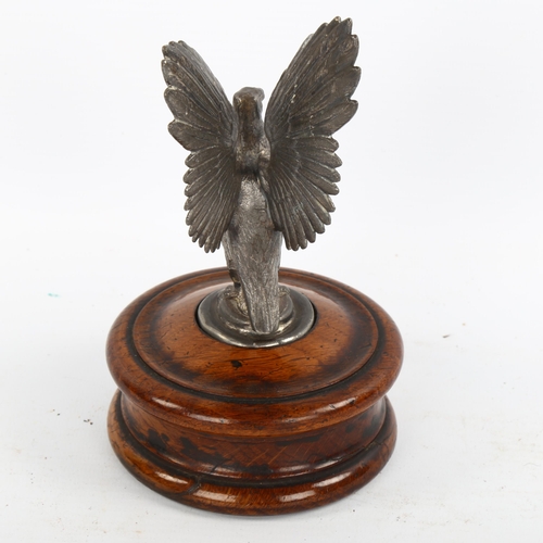 1184 - A mid-20th century spelter eagle design car mascot on wooden plinth, height 16cm