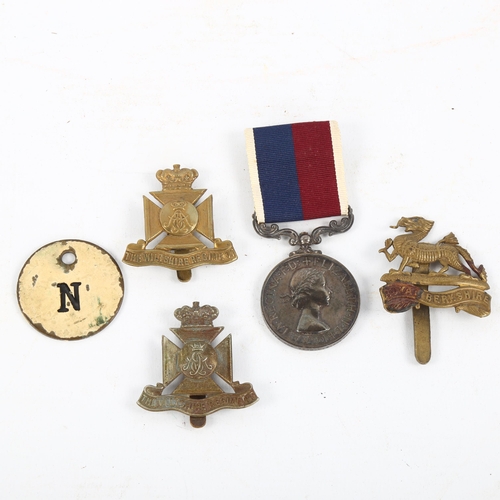 1210 - A group of military cap badges