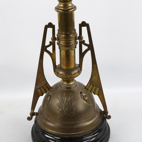 1220 - An Art Neuveau oil lamp with blue glass well and shade, height 76cm