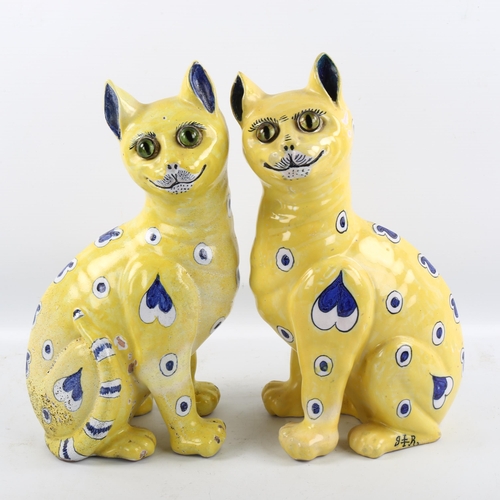 1221 - Emile Galle (1846-1904), a pair of Art Nouveau faience pottery cats, with applied glass eyes, both w... 