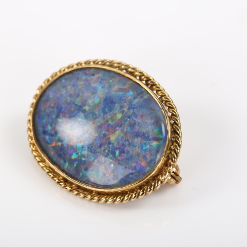 351 - A late 20th century 9ct gold opal doublet brooch, with rope twist surround, hallmarks London 1978, b... 