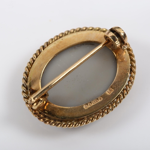 351 - A late 20th century 9ct gold opal doublet brooch, with rope twist surround, hallmarks London 1978, b... 