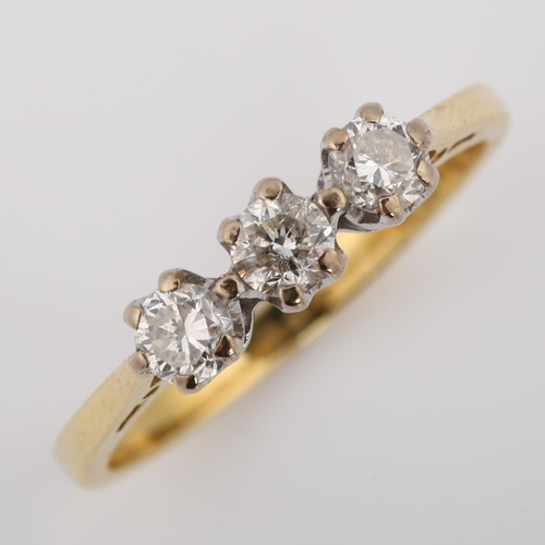 352 - An 18ct gold three stone diamond ring, set with modern round brilliant-cut diamonds, total diamond c... 