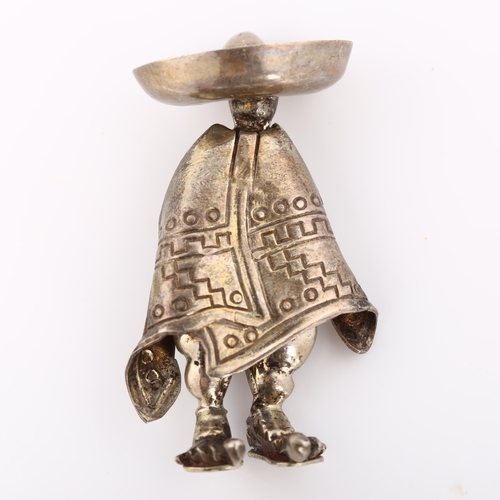 354 - A Mexican silver figural man in poncho and sombrero brooch, brooch height 40.1mm, 9.4g