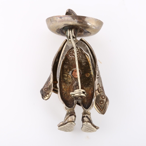 354 - A Mexican silver figural man in poncho and sombrero brooch, brooch height 40.1mm, 9.4g