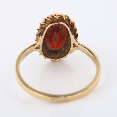 362 - A 9ct gold garnet dress ring, set with oval step-cut garnet within rope twist surround, setting heig... 