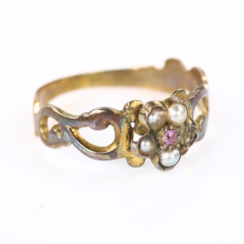 366 - A Victorian garnet and pearl flowerhead cluster ring, unmarked gold closed-back settings, setting he... 