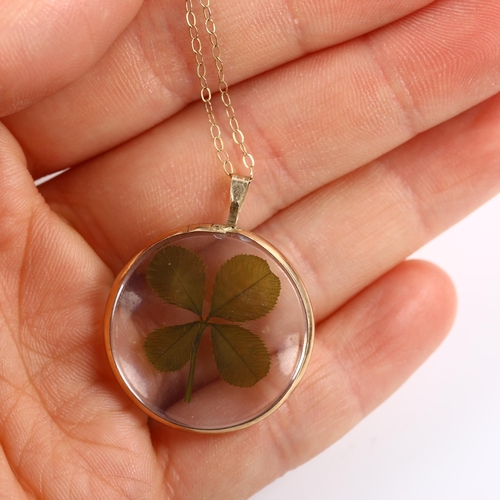 380 - A Vintage four-leaf clover locket pendant necklace, within crystal and unmarked yellow metal frame o... 