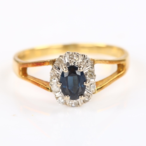 385 - A late 20th century 18ct gold sapphire and diamond cluster ring, set with oval mixed-cut sapphire an... 