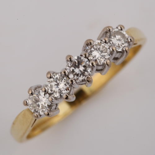 407 - A modern 9ct gold five stone diamond ring, setting height 4.3mm, size K, 2.1g