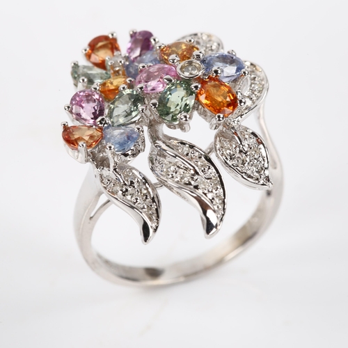 409 - A modern 18ct white gold vari-hue sapphire and diamond floral cluster cocktail ring, total diamond c... 