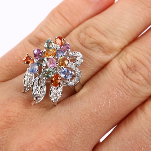 409 - A modern 18ct white gold vari-hue sapphire and diamond floral cluster cocktail ring, total diamond c... 