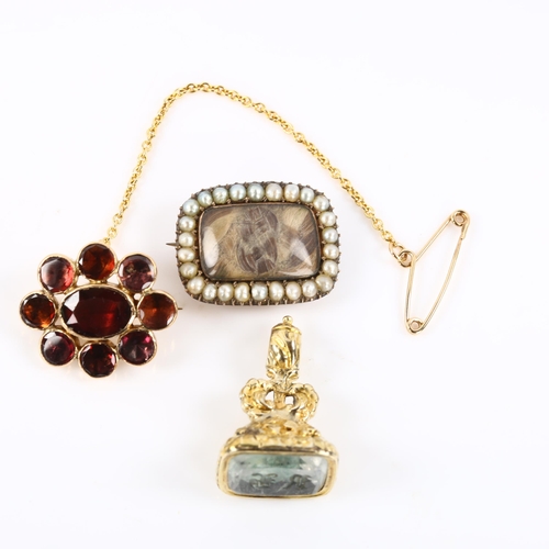 426 - 3 pieces of Victorian jewellery, comprising unmarked yellow metal seal fob, garnet cluster brooch an... 