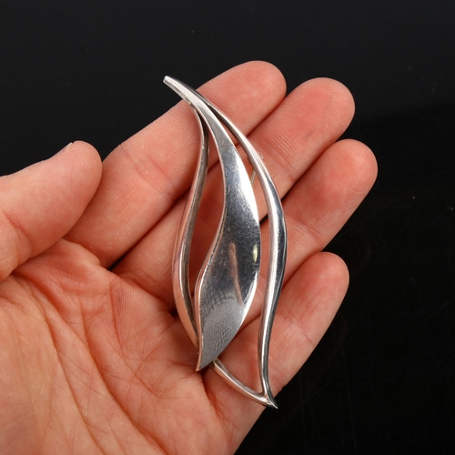 439 - JUST ANDERSEN - a Danish stylised sterling silver leaf brooch, model no. 742, and a large pewter sla... 