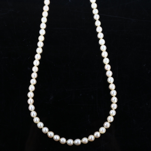 464 - MIKIMOTO - a single strand cultured pearl necklace with silver clasp, bead diameter 11mm, necklace l... 